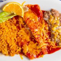 Enchiladas De Mole (2) · Mole sauce, chicken, topped with cheese, rice & beans on the side