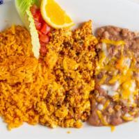 Chorizo Con Huevos · Chorizo mixed in with eggs, choice of tortilla, rice & beans on the side