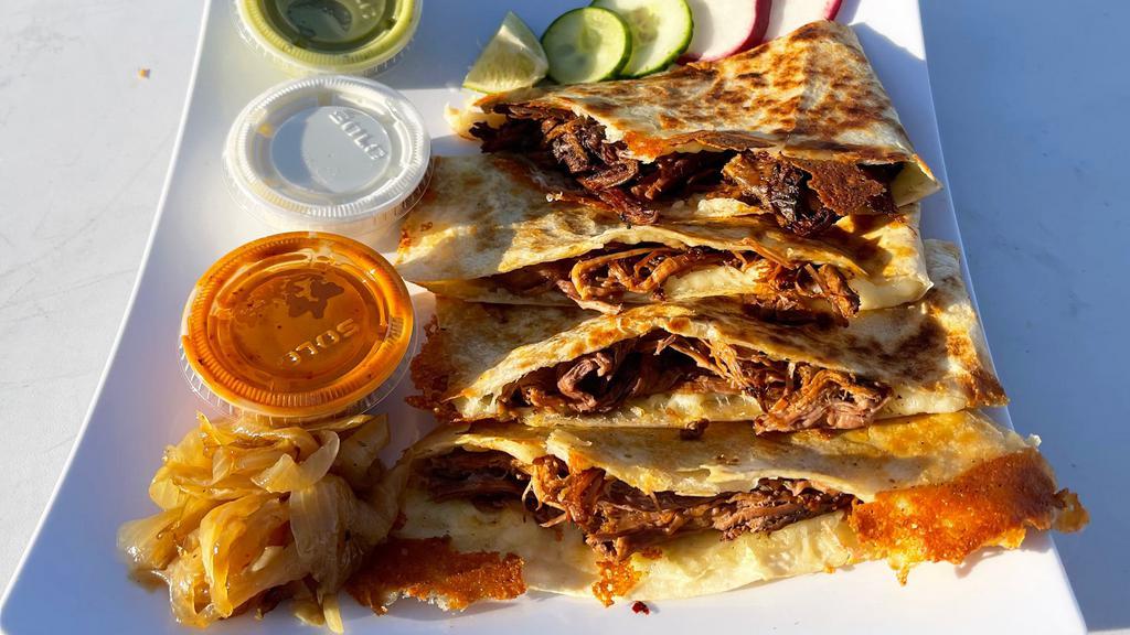 Quesadilla · LARGE FLOUR TORTILLA FILLED WITH FRESH MELTED MOZZARELLA  AND HEFTY PORTION OF TENDER BARBACOA PULLED BEEF .