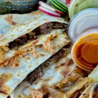Loaded Quesadilla · Large fresh flour tortilla - Filled with melted cheese and your choice of meat . On the side...