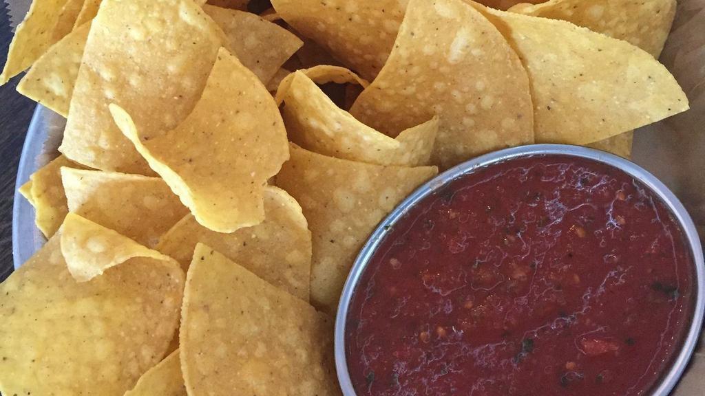 Chips And Salsa · One plate of house corn chips with 4oz red salsa.