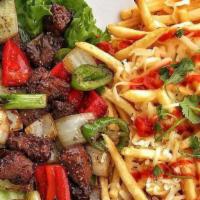 Shaken Beef And Fries · French fries with shaken beef.