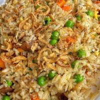 Chicken Fried Rice · Fried rice stir-fried with egg, marinated chicken with pea and carrots, and green onions.