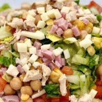 Chopped Salad · Chopped romaine, tomatoes, garbanzo, corn, Italian antipasto, chopped ham, chopped chicken, ...