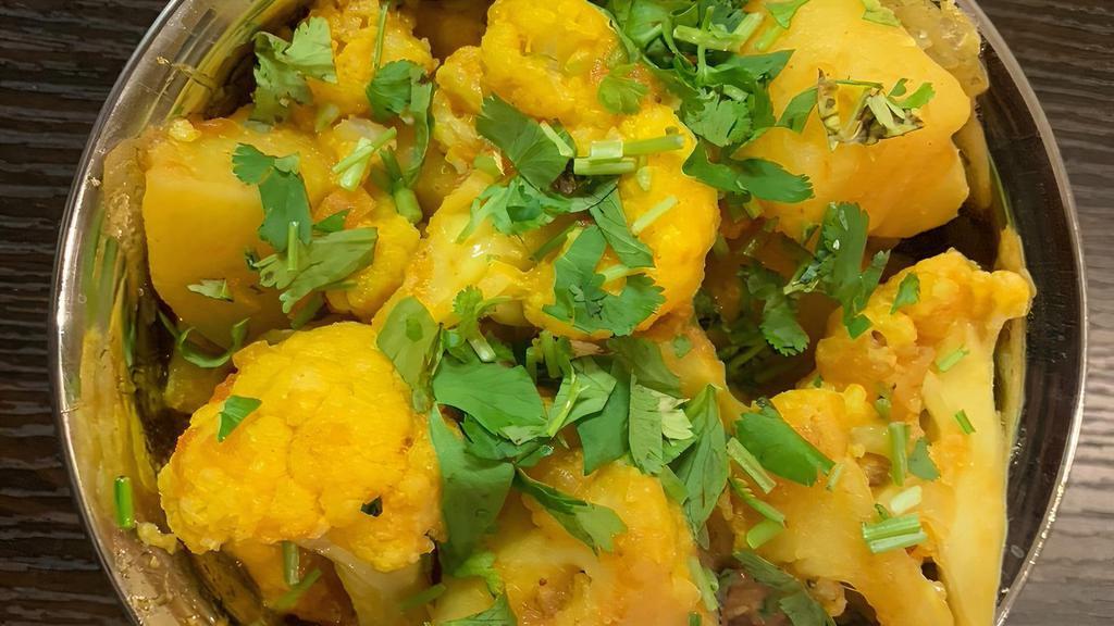 Aloo Gobi · Vegetarian. Cauliflower and potatoes with onion and tomato sauce cooked with Himalayan spices.