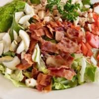 Cobb Salad · All of our salads include garlic roll. Turkey breast, tomato, bacon, fresh avocado, and a ha...
