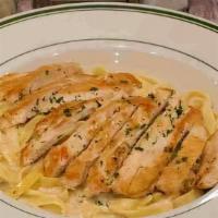 Fettuccine Alfredo With Chicken Breast · Served with choice of soup or salad and garlic bread.