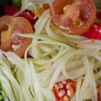 Som Tum · Fresh green papaya salad, garlic, tomatoes, plam sugar, lime juice and chill, pounded in a m...