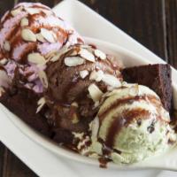 Baked Brownie Sundae · Baked gluten-free brownie with a scoop of chocolate, strawberry and vanilla ice cream, toppe...