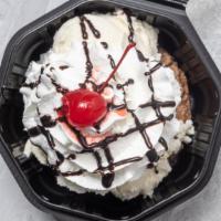 Cookie Sundae · 2 scoops of vanilla ice cream on top of a warm cookie topped with whip cream and a cherry