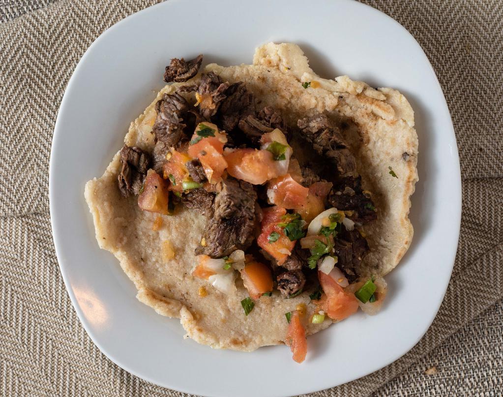 Classic Steak Taco · Authentic taco with steak on fresh-made corn or flour tortillas, served with fresh pico de gallo.