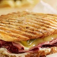 Pastrami Panini · Pastrami, provolone cheese, pickles, mustard, pickled onions and mayo.
