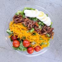 Cobb Salad · Romaine, cheddar, tomatoes, hard boiled egg, bacon. Comes with Blue Cheese Dressing