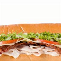 Turkey Club · Turkey breast with bacon and Swiss cheese on a french baguette. Includes mayo, tomato, and l...