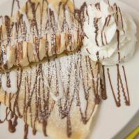 Banana-Rama Crepe · Nutella and hand sliced bananas, topped with hazelnuts and whip-creme.