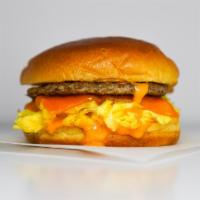 Brioche Sausage, Egg And Cheddar Sandwich · 2 fresh cracked cage-free scrambled eggs, melted Cheddar cheese, breakfast sausage, and Srir...