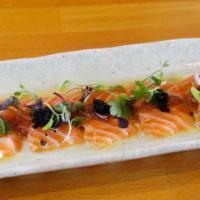 Salmon Carpaccio (8 Pcs) · Salmon sashimi with umeshisho vinaigrette topped with black tobiko and micro greens.