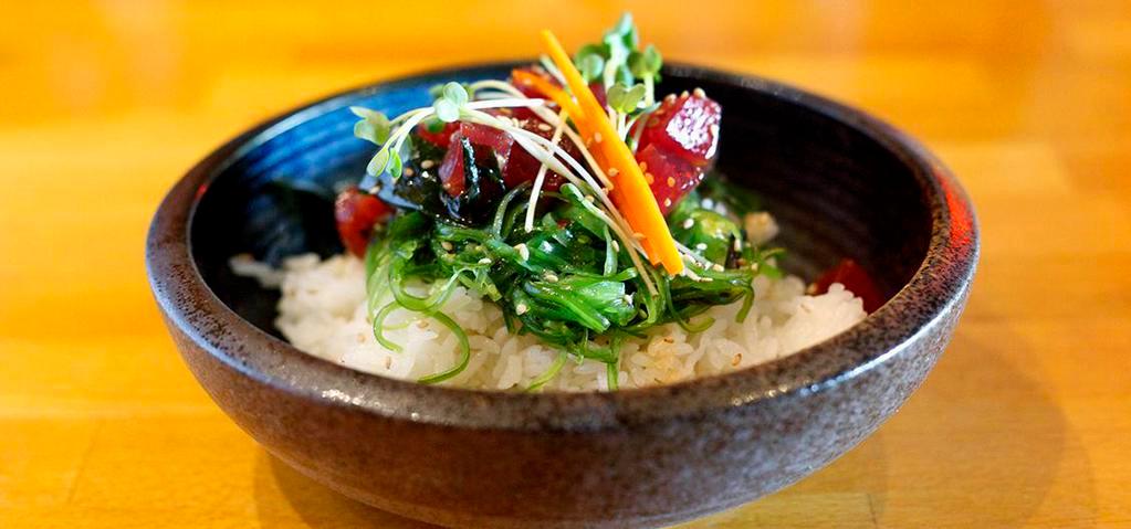 Poke Bowl · Ahi tuna, albacore, yellowtail, salmon, and shrimp with seaweed salad over sushi rice.