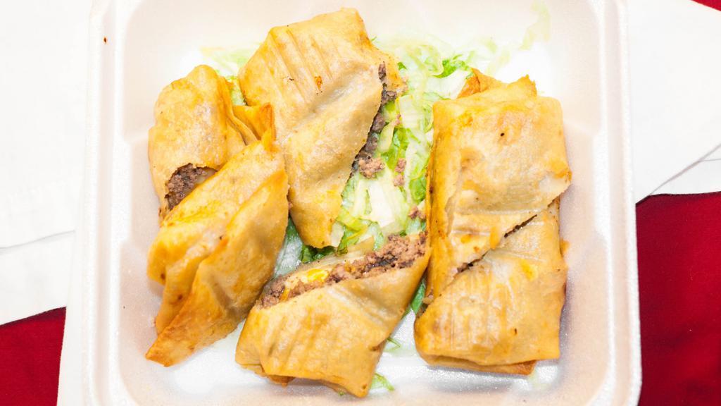 Mini Chimichangas · Your choice of meat, guacamole, and sour cream.