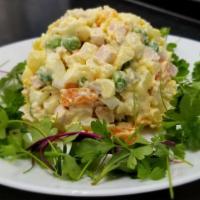 Olivie  · Russian potato salad. Made with cooked potatoes & carrots,  onions , hard boiled eggs, peas,...