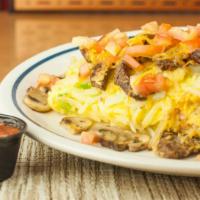 Steak Omelette · Steak, mushrooms, onions, green pepper, tomatoes and cheddar cheese with salsa.