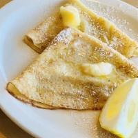Lemon Butter Crepes · Four crepes with lemon butter.