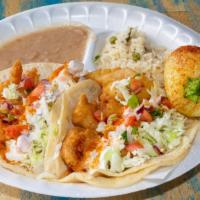 Dos Tacos De Camaron · Arroz, frijoles y soda. Two shrimp tacos, rice, beans and soda.