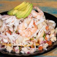 Tostada Baja Style · 3 ceviches (shrimp, fish, jaiba)
Whole shrimp, octopus, snails, scallops, abalone, clams top...