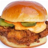 Spicy Bird - Fried Chicken Sandwich · Fried chicken breast, spicy bird sauce spread, and pickles served on a brioche bun