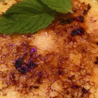 Creme Brulee · With vanilla bean and caramelized sugar.
