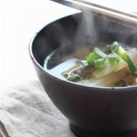 Miso Soup (W/ Green Onion & Tofu) · Fermented Bean Paste Soup. 
Traditional Japanese. Full of Probiotics.
Served with Tofu and G...