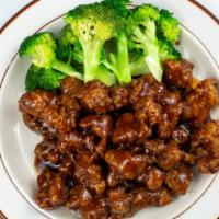 No13. General Tso'S Chicken · Chunks fried chicken on the inside in brown general tso's sauce on bed of broccoli.