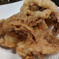 Ika Geso · Crispy fried squid legs with tempura sauce.