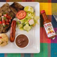 Grilled Beef /  Carne Asada · With salad, rice, tortillas cheese or sauce/  Incluye six ounces de carne, arroz, ensalada s...