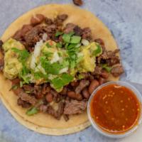Big Taco · Choice of meat with Whole Beans Cheese, Guacamole, Onion, Cilantro, and Salsa.