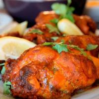 Chicken Tandoori · Grilled chicken marinated in yogurt and spices.