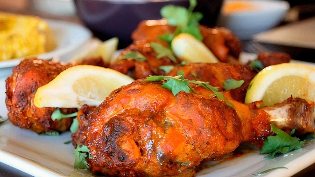 Chicken Tandoori · Grilled chicken marinated in yogurt and spices.
