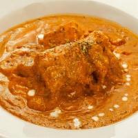 Chicken Makhani · Pieces of chicken cooked in an exotic tomato, nut and butter sauce.