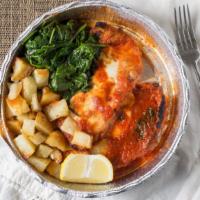 Pollo Parmigiana · (Chicken Parmigiana) Served with roasted potatoes and sautéed spinach.
