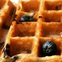 Blueberry Waffles · Two Belgian Waffles, Powder Sugar, Honey Butter, Sweet Condense Milk, Berry Compote, Seasona...