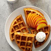 Peach Cobbler Pie · Two Belgian Waffles, Powder Sugar, Honey Butter, Sweet Condense Milk, Seasonal Peaches, Vani...