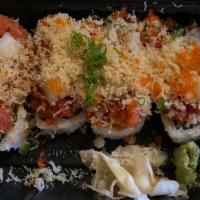 Blooming · Deep fried shrimp, cucumber, crab meat, spicy tuna, scallop, tempura flakes, and sauce.