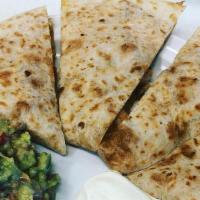Quesadilla · Your choice of meat, cheese.  Guacamole and sour cream on the side.