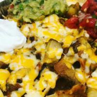 Nachos · Chips, beans, cheese, your choice of meat. Topped with guacamole, sour cream and pico de gal...