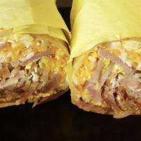 Breakfast Burrito  · Burrito includes, meat of your choice, cheese, hash browns and 2 eggs.