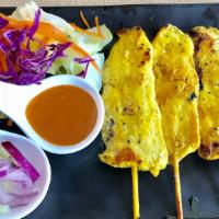 Chicken Satay · Grilled marinated chicken with peanut sauce and cucumber salad