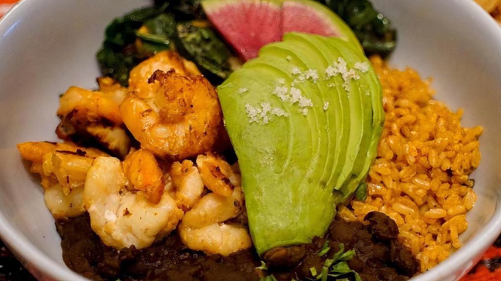 Shrimp Bowl · mojo marinated shrimp, farmer's veggie, black beans, avocado, and guajillo salsa. choice of brown rice, flaco (lettuce), or cauliflower rice $2.