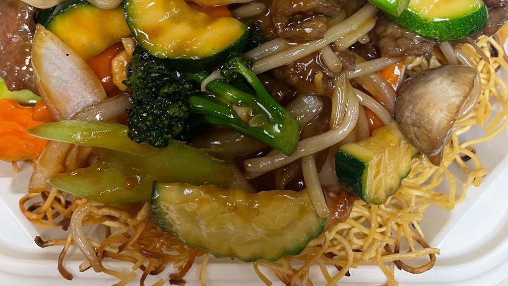 Hong Kong Style Chow Mein · chicken, beef, and shrimp sauteed with vegetables over pan fried egg noodles
