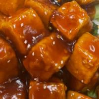 Szechuan Tofu · Spicy.  breaded tofu lightly fried and sauteed in spicy sauce
