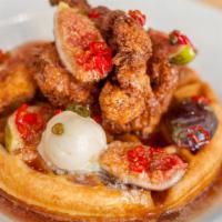 Chicken & Waffle · Belgian buttermilk waffle. fried Mary’s chicken breast. roasted kumquat syrup. butter. $18. ...